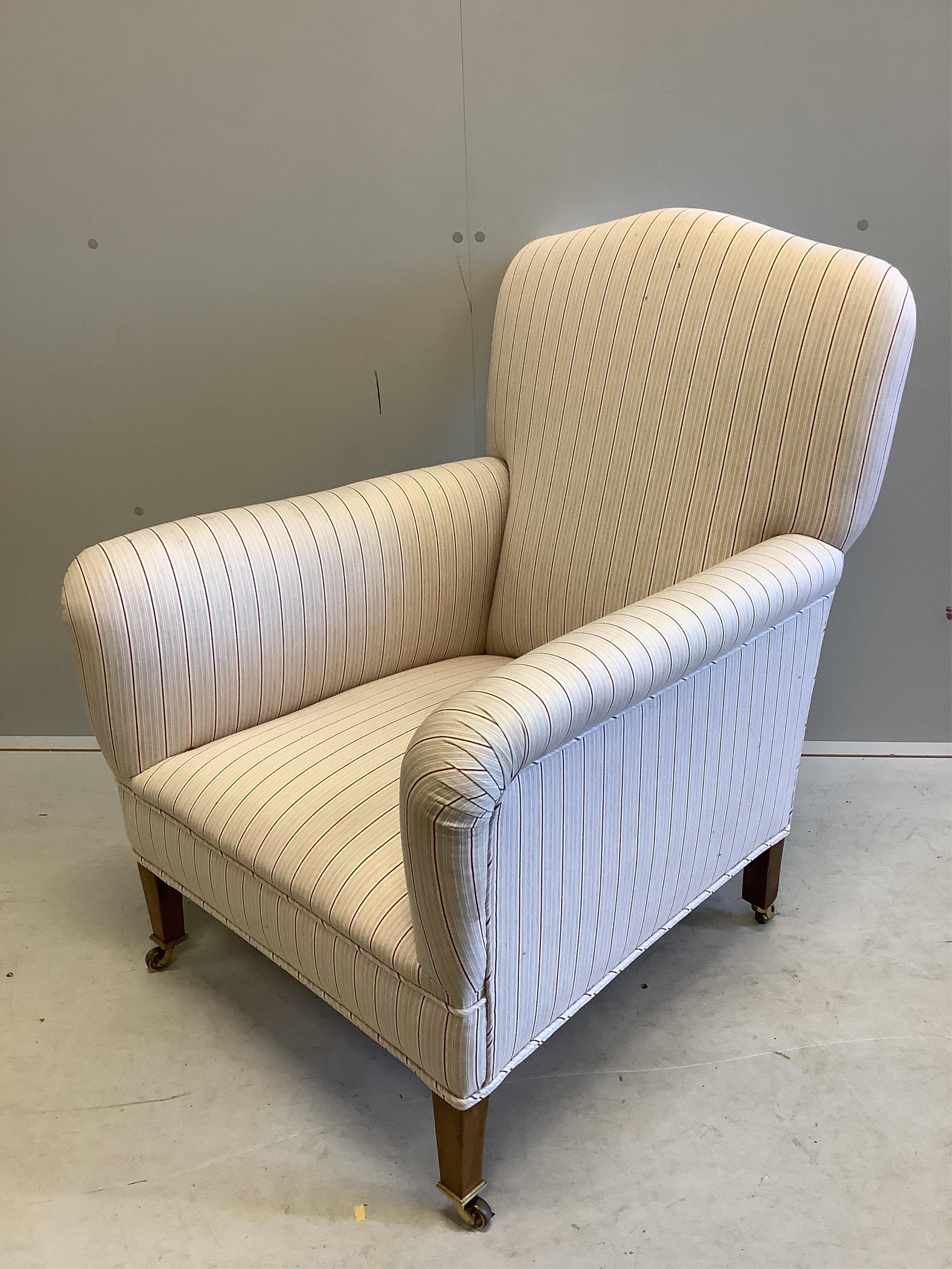 An Edwardian upholstered armchair, width 69cm, depth 75cm, height 90cm. Condition - good